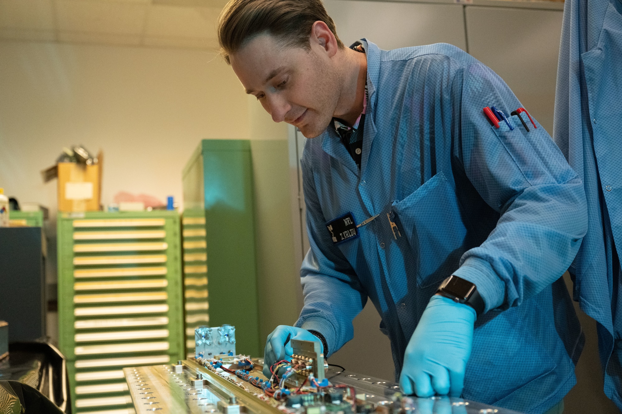 WASHINGTON (March 4, 2022) – Zachary Kaldy, U.S. Naval Research Laboratory thermal engineer, inspects the Space Wireless Energy Laser Link (SWELL) in Washington, D.C. April 3, 2022. SWELL will launch aboard the DoD Space Test Program-H9 payload (STP-H9) to the International Space Station in 2023, where it will then be powered on and operate for one to two years. SWELL will be the first on-orbit demonstrations of Laser Power Beaming. (U.S. Navy photo by Jonathan Sunderman)