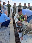 Members of the 235th Civil Engineering Flight and their partners analyze the runway at Amari Air Base in Harjumaa, Estonia.