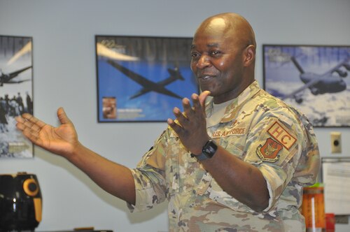 a man speaks to a group of people