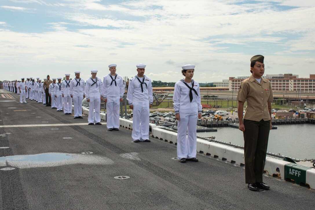 U.S. Marines and Sailors with the Bataan Amphibious Ready Group and the 26th Marine Expeditionary Unit (Special Operations Capable) (MEU(SOC)) man the rails of the Wasp-class amphibious assault ship USS Bataan (LHD 5), Naval Station Norfolk, Virginia, Jul. 10, 2023. Manning the rails is a long-standing naval tradition performed to render honors prior to a ship departing a port. The 26th MEU(SOC) and Bataan ARG are trained and certified in a wide range of flexible capabilities across the spectrum of military conflict. Throughout their deployment, they will train and conduct operations alongside Allies and Partners, improving interoperability while demonstrating the combat power and flexibility of the Navy-Marine Corps team.