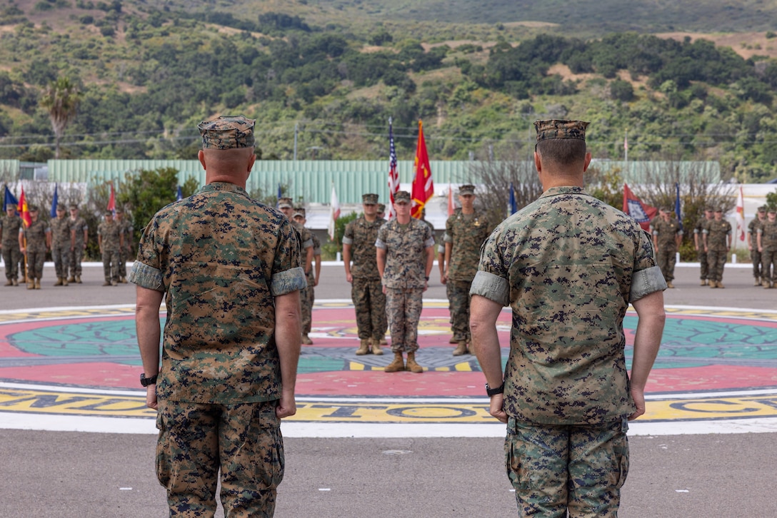 U.S. Marine Corps Lt. Col. Thomas Carey, right, the outgoing commanding officer of Advanced Infantry Training Battalion, School of Infantry -West, stands with Lt. Col. Lonnie Wilson the incoming commanding officer of AITB, SOI-West, during a change of command ceremony on Marine Corps Base Camp Pendleton, California, July 7, 2023. AITB, SOI-West, trains, coaches, and qualifies entry-level Marines and Sailors in reconnaissance and advanced infantry skills to fight and win in current and future operating environments. (U.S. Marine Corps photo by Sgt. Andrew Cortez)
