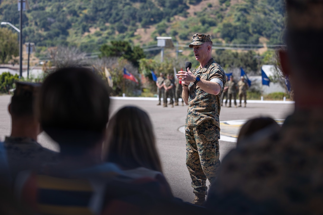 U.S. Marine Corps Col. Seth MacCutcheon, the commanding officer of School of Infantry – West, delivers remarks during a change of command ceremony for the Advanced Infantry Training Battalion, SOI-West on Marine Corps Base Camp Pendleton, California, July 7, 2023. During the ceremony, Lt. Col. Thomas Carey, the outgoing commanding Officer of Advanced Infantry Training Battalion, School of Infantry - West relinquished command to Lt. Col. Lonnie Wilson, the incoming commanding officer. AITB, SOI-West, trains, coaches, and qualifies entry-level Marines and Sailors in reconnaissance and advanced infantry skills to fight and win in current and future operating environments.  (U.S. Marine Corps photo by Sgt. Andrew Cortez)