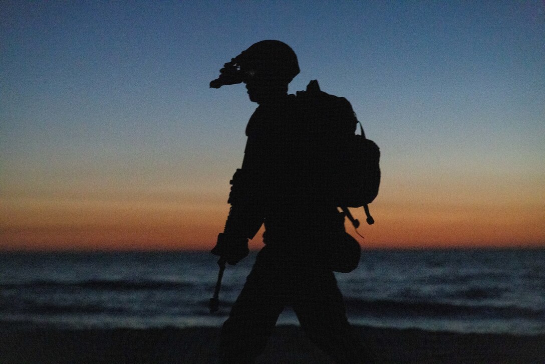 USTKA, POLAND (JUN 12 2023) A U.S. Marine with Golf Company, 2d Battalion, 6th Marine Regiment, 2d Marine Division patrols along a beach during exercise Baltic Operations 2023 (BALTOPS 23) in Ustka, Poland, June 12, 2023. BALTOPS 23 is the premier maritime-focused exercise in the Baltic region. The exercise led by U.S. Naval Forces Europe-Africa and executed by Naval Striking and Support Forces NATO provides a unique training opportunity to strengthen the combined response capability critical to preserving the freedom of navigation and security in the Baltic Sea. (U.S. Marine Corps photo by Lance Cpl. Ryan Ramsammy)