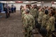 Service members stand for "presentation of colors"