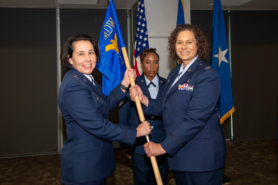 Wing commander hands guidon to new group commander