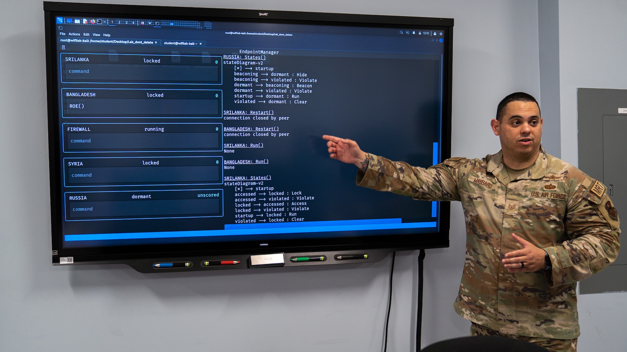U.S. Air Force Tech. Sgt. Jason Massard, 333rd Training Squadron cyber warfare operations section chief, briefs project errors to an audience at Stennis Hall on Keesler Air Force Base, Mississippi, July 11, 2023. The 333rd TRS teaches Undergraduate Cyber Training, Cyber Warfare Operations, IT Fundamentals and Spectrum Operations. (U.S. Air Force photo by Senior Airman Kimberly L. Touchet)