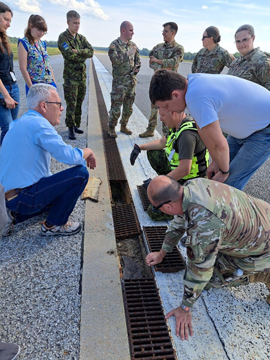 Members of the 235th Civil Engineering Flight and their partners analyze the runway at Amari Air Base in Harjumaa, Estonia.