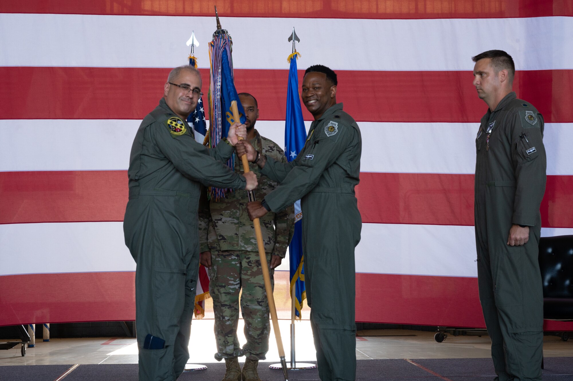 U.S. Air Force Col. Daniel Alford, 7th Operations
Group commander, presents the guidon to Lt. Col.
Brian Milner, incoming 9th Bomb Squadron
commander, during the 9th BS change of command
ceremony at Dyess Air Force Base, Texas, July 7,
2023. Milner is in charge of leading the 9th BS which
is the oldest active bomb squadron in the Air Force
and maintains combat readiness to ensure delivery of
rapid and decisive airpower on a large scale in
support of conventional warfare taskings around the
world. (U.S. Air Force photo by Airman 1st Class
Alondra Cristobal Hernandez)