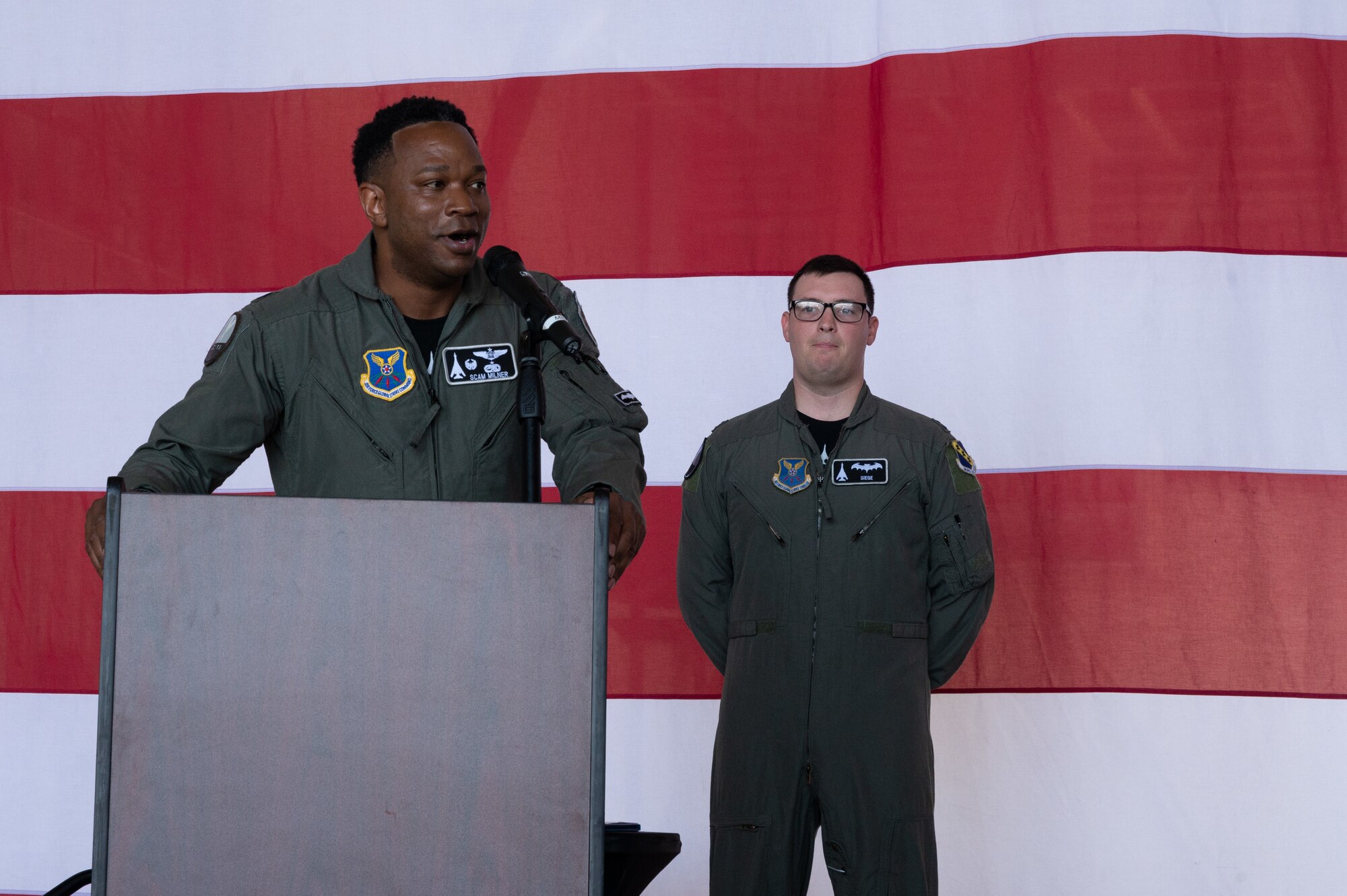 U.S. Air Force Lt. Col. Brian Milner, 9th Bomb
Squadron commander, delivers remarks after
assuming command of the squadron during the 9th
BS change of command at Dyess Air Force Base,
Texas, July 7, 2023. Milner is in charge of leading the
9th BS which is the oldest active bomb squadron in
the Air Force and maintains combat readiness to
ensure delivery of rapid and decisive airpower on a
large scale in support of conventional warfare
taskings around the world. (U.S. Air Force photo by
Airman 1st Class Alondra Cristobal Hernandez)