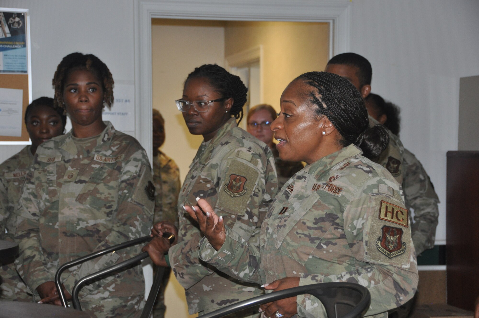 a woman speaks to a group of people