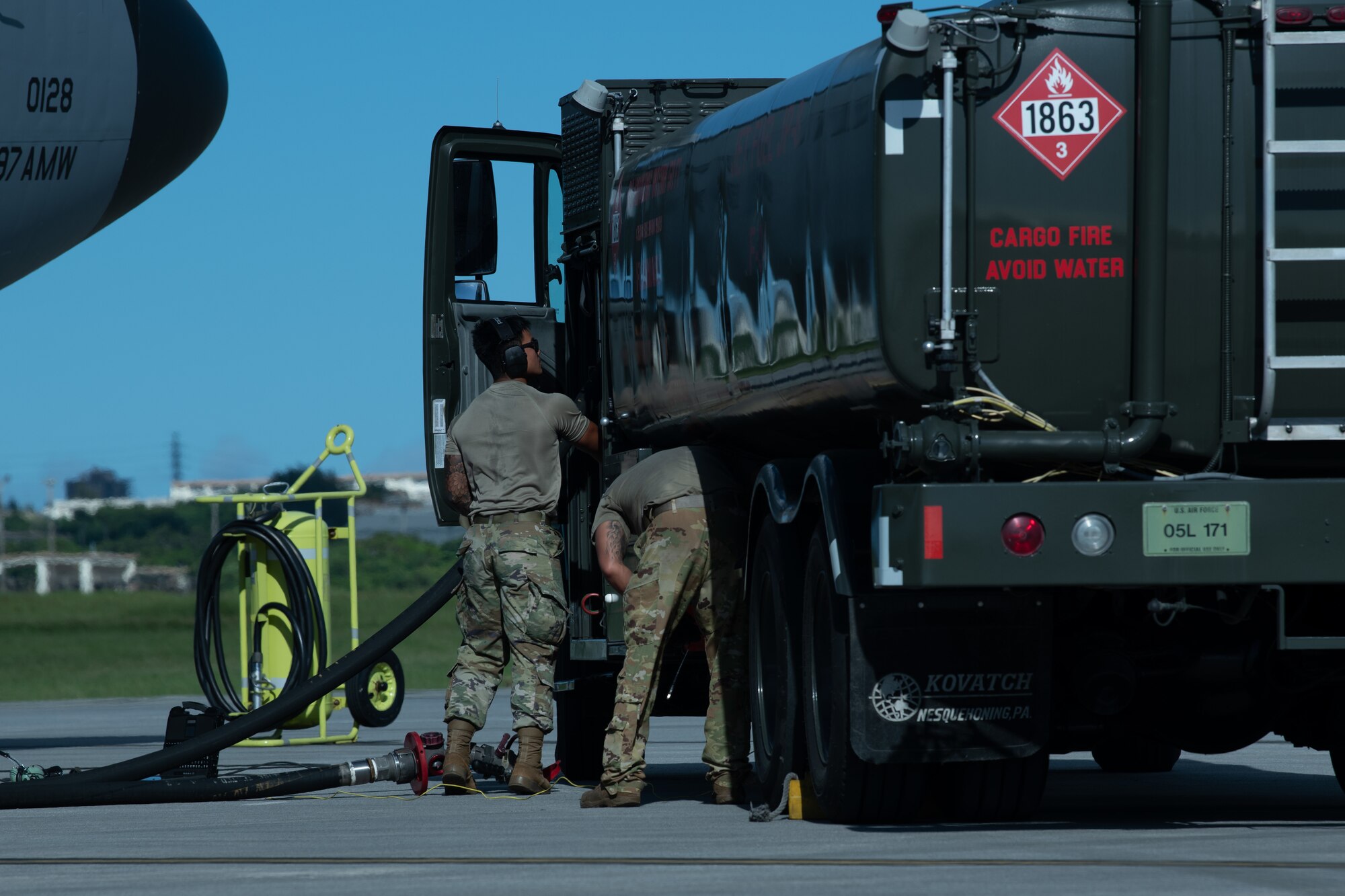 U.S. Air Force Airmen assigned to the secure the fuel pump during a hot-pit refueling.