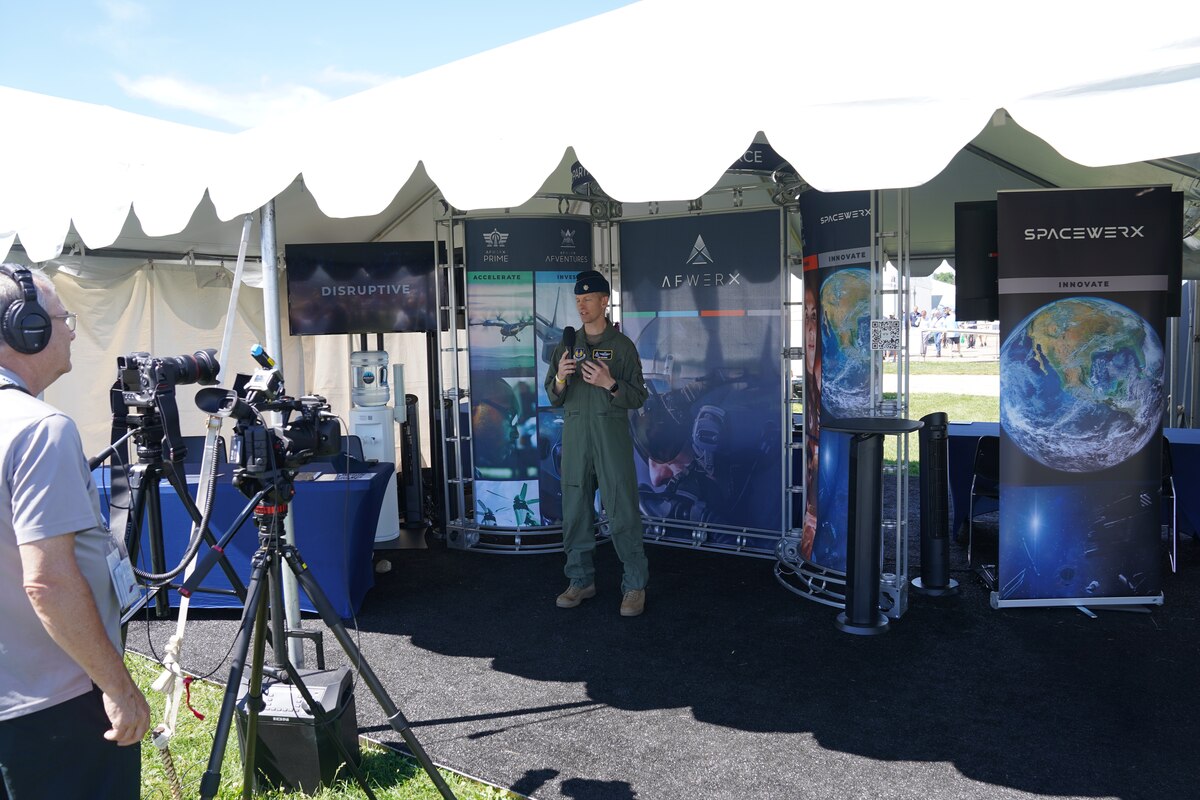 Lt. Col. Thomas Meagher, AFWERX Prime division chief, speaks to the media at the Oshkosh Air Show, Wisconsin, July 25, 2022. (U.S. Air Force photo by Dennis Stewart)