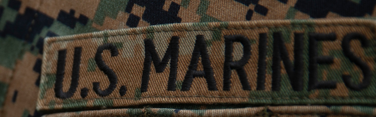U.S. Marine Corps Sgt. Andrew S. Peel, an instructor assigned to Financial Management School, Marine Corps Combat Service Support Schools, receives a Navy and Marine Corps Achievement medal, during the Instructor of the Year ceremony at Camp Johnson, N.C., March 15, 2018. The Instructor of the Year ceremony recognizes instructors who have demonstrated sustained superior performance in their instructional abilities. (U.S. Marine Corps photo released/by Lance Cpl. Luis E. Zamot III)