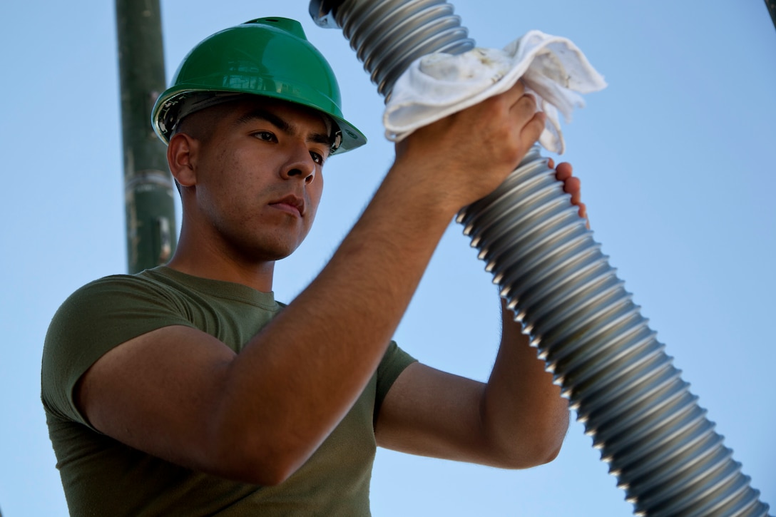 A U.S. Marine assigned to the AN/TPS-59(v)3 Radar Repair Course, Marine Corps Communications-Electronics School, set up a AN/TPS-59(v)3 long range air surveillance radar at Marine Corps Base Twentynine Palms, Calif., March 13, 2017. The mission of Communications-Electronics School is to train Marines in ground electronics maintenance, tactical communications, and anti-air warfare operations for the Fleet Marine Force. (U.S. Marine Corps photo by Lance Cpl. Jose Villalobosrocha)