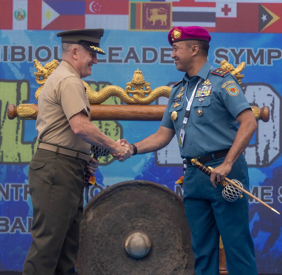 U.S. Marine Corps Lt. Gen. William M. Jurney, left, commander, U.S. Marine Corps Forces, Pacific, shakes hands with Indonesian Marine Corps Maj. Gen. Nur Alamsyah, commandant, Korps Marinir Republik Indonesia during the closing ceremony of the Pacific Amphibious Leaders Symposium, Bali, Indonesia, July 13, 2023. PALS strengthens our interoperability and working relationships across a wide range of military operations – from humanitarian assistance and disaster relief to complex expeditionary operations. This year's symposium hosted senior leaders from 24 participating nations who are committed to a free and open Indo-Pacific, with the objective of strengthening and developing regional relationships. (U.S. Marine Corps photo by Cpl. Lindheimer)