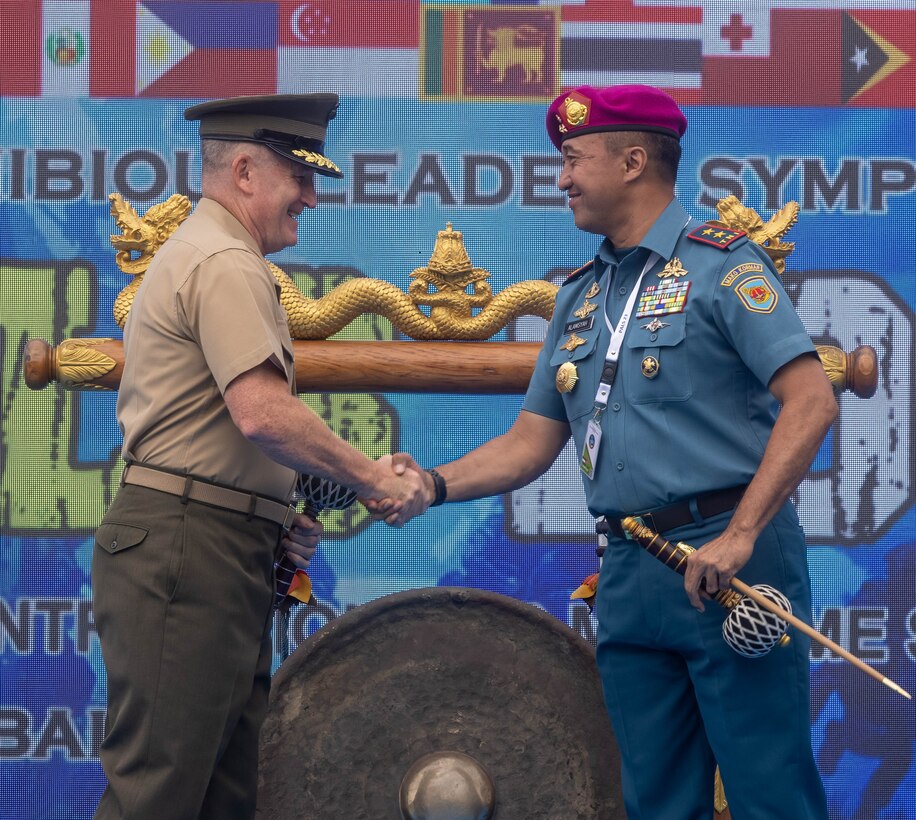U.S. Marine Corps Lt. Gen. William M. Jurney, left, commander, U.S. Marine Corps Forces, Pacific, shakes hands with Indonesian Marine Corps Maj. Gen. Nur Alamsyah, commandant, Korps Marinir Republik Indonesia during the closing ceremony of the Pacific Amphibious Leaders Symposium, Bali, Indonesia, July 13, 2023. PALS strengthens our interoperability and working relationships across a wide range of military operations – from humanitarian assistance and disaster relief to complex expeditionary operations. This year's symposium hosted senior leaders from 24 participating nations who are committed to a free and open Indo-Pacific, with the objective of strengthening and developing regional relationships. (U.S. Marine Corps photo by Cpl. Lindheimer)