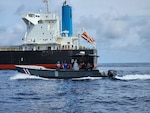 U.S. Air Force pararescuemen with the 131st Rescue Squadron, 129th Rescue Wing, California Air National Guard transfer a patient by hoist down to a Costa Rican Coast Guard vessel, July 11, 2023.