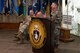 Man in U.S. Army uniform stands at podium talking.