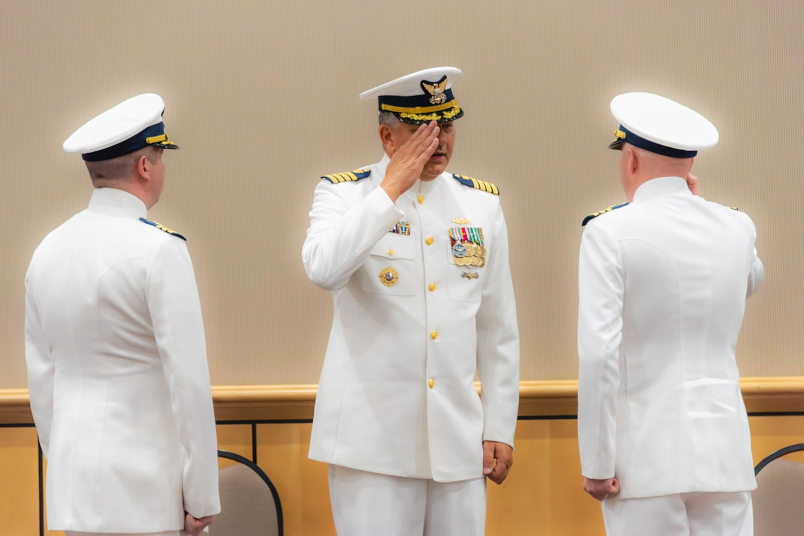 Capt. Francis J. DelRosso, Coast Guard Sector Charleston commander, Cmdr. Kevin Broyles, former Marine Safety Unit Savannah Commander, and Cmdr. Nathaniel Robinson, MSU Savannah commander, renders customs and courtesy during a change-of-command ceremony in, Savannah, Georgia, July 13, 2023. MSU Savannah has a crew of 57 active duty, reserve, and civilian personnel that safeguards 116 miles of sensitive shoreline along the Georgia coast and covers 95 % of all navigable waterways in Georgia. (U.S. Coast Guard courtesy photo)