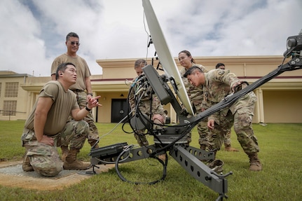 Airmen of the 154th Combat Comm. Squadron, Hawaii Air National Guard, assist members of the Guam National Guard with emergency communications equipment following Typhoon Mawar in Barrigada May 28, 2023.