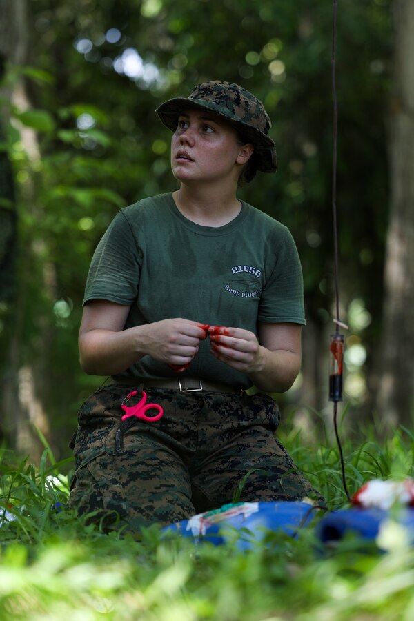 U.S. Navy Hospital Corpsman 3rd Class Kiana Hamilton with Combat Logistics Battalion 8 (CLB-8), Combat Logistics Regiment 2 (CLR-2), 2nd Marine Logistics Group (2nd MLG), demonstrates how to pack a wound with gauze to Marines of the Colombian Naval Infantry during an advanced technical medical course for UNITAS LXIV aboard Escuela de Formación de Infantería Marina Coveñas in Coveñas, Colombia, July 13, 2023. UNITAS, taking place in Colombia this year, is the world’s longest-running annual multinational maritime exercise that focuses on enhancing interoperability among multiple nations and joint forces during littoral and amphibious operations in order to build on existing regional partnerships and create new enduring relationships that promote peace, stability, and prosperity in the U.S. Southern Command’s area of responsibility. (U.S. Marine Corps photo by Lance Cpl. Mary Kohlmann)