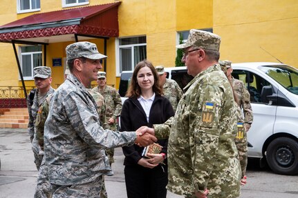 Chief of the National Guard Bureau, General Joseph Lengyel shakes hands with the Commander of the Land Force Academy, Lt. Gen. Tkachuk, July 31 in Yavoriv, Ukraine.