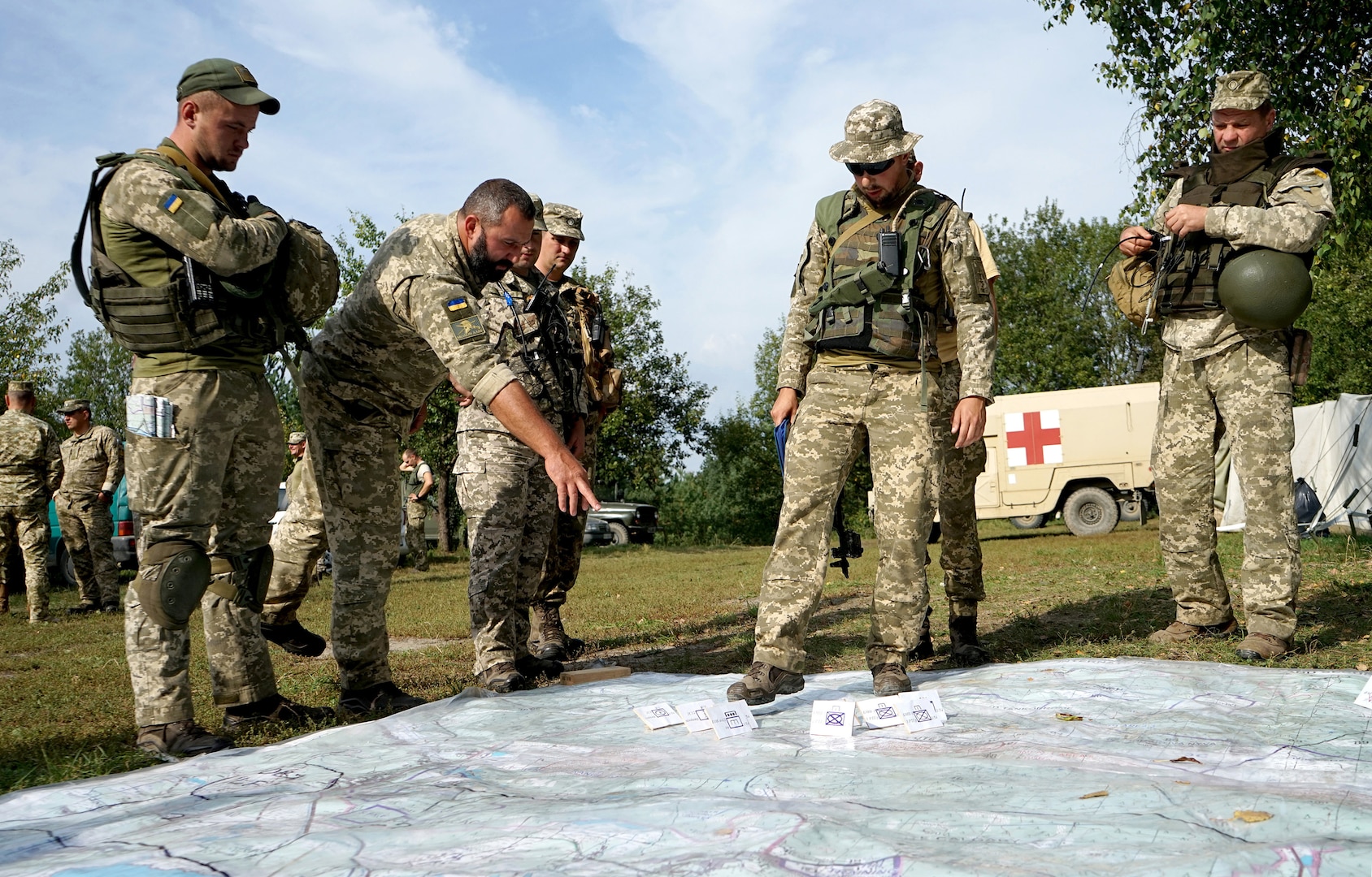 Ukrainian soldiers walk through strategic plans for an exercise during an Operational Capabilities Concept evaluation at the International Peacekeeping and Security Centre in Yavoriv, Ukraine, Sept. 11, 2018.