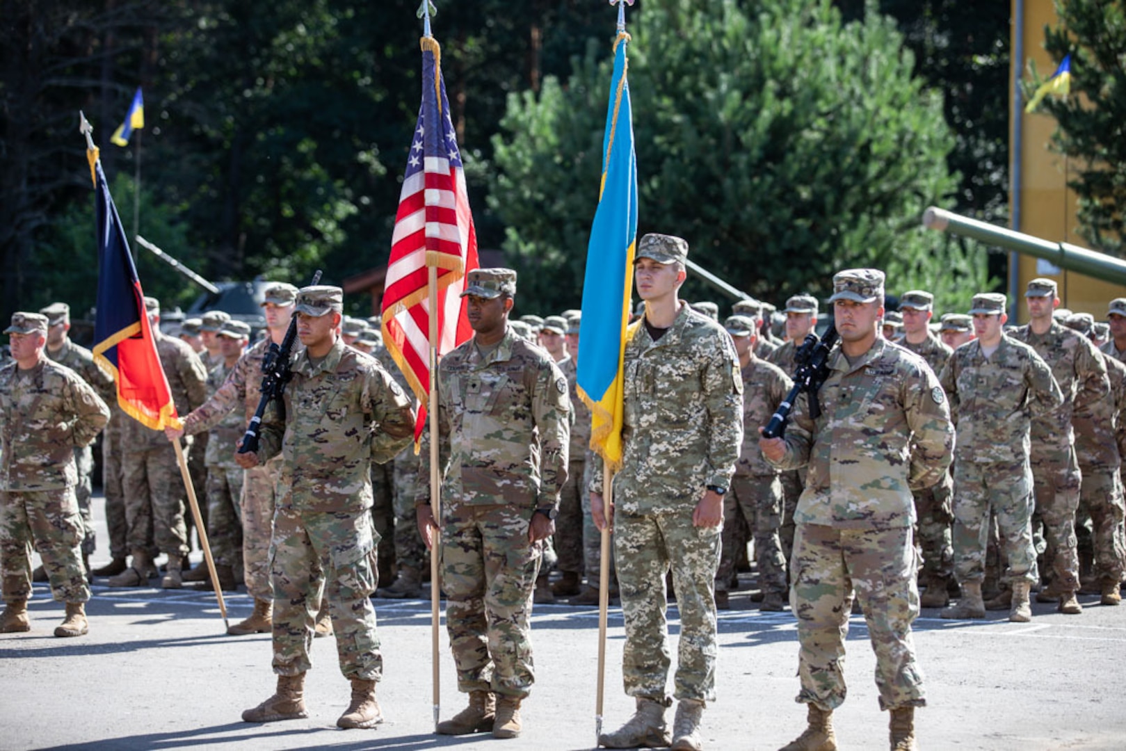 Soldiers stand at ease during the Transfer of Authority ceremony, Aug.8.