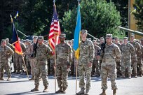 Soldiers stand at ease during the Transfer of Authority ceremony, Aug.8.