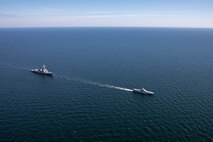 The Arleigh Burke-class guided-missile destroyer USS Roosevelt (DDG 80), left, and the Swedish Navy Visby-class corvette HSwMS Härnösand (K 33) steam in formation during Neptune Strike 23-2, in the Baltic Sea, July 12, 2023. Roosevelt is participating in Neptune Strike 23-2, a multiyear effort focused on the integration of U.S. and NATO allied and partner international force to provide assurance, deterrence, and collective defense for the Alliance and STRIKFORNATO. (U.S. Navy photo by Mass Communication Specialist 2nd Class Elexia Morelos)