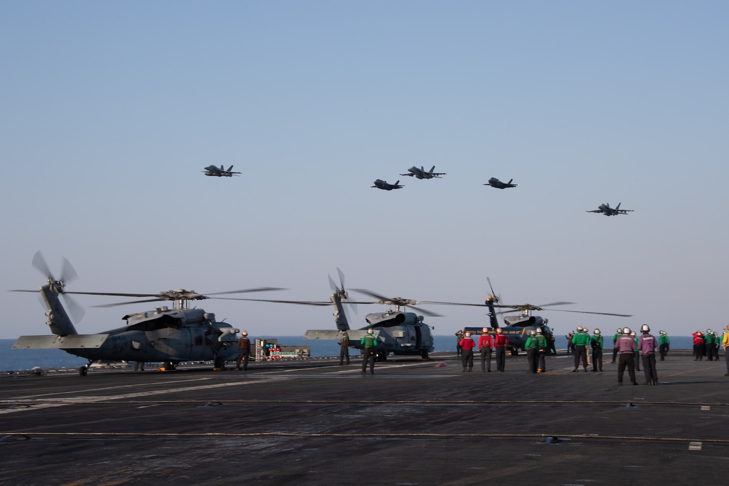 F/A-18s attached to Carrier Air Wing (CVW) 8 and Italian F-35s fly in formation by the world's largest aircraft carrier USS Gerald R. Ford (CVN 78), July 10, 2023. Gerald R. Ford is participating in Neptune Strike, a multiyear effort focused on harmonizing U.S. and NATO planning teams to transfer command and control of Allied naval and amphibious forces to STRIKFORNATO, in order to provide assurance, deterrence, and collective defense for the Alliance. (U.S. Navy photo by Mass Communication Specialist 2nd Class Jennifer Newsome)