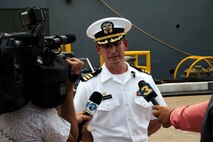 NORFOLK, Va. - Cmdr. Robert D. Ireland, commanding officer of the Arleigh Burke-class guided-missile destroyer USS James E. Williams (DDG 95), speaks with local media outlets following the ship's return to Naval Station Norfolk after a seven-month NATO deployment, July 14, 2023. James E. Williams served as the flagship for Standing NATO Maritime Group (SNMG) 2. (U.S. Navy photo by Mass Communication Specialist 1st Class Jacob T. Waldrop)