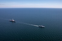 The Arleigh Burke-class guided-missile destroyer USS Roosevelt (DDG 80), left, and the Swedish Navy Visby-class corvette HSwMS Härnösand (K 33) steam in formation during Neptune Strike 23-2, in the Baltic Sea, July 12, 2023. Roosevelt is participating in Neptune Strike 23-2, a multiyear effort focused on the integration of U.S. and NATO allied and partner international force to provide assurance, deterrence, and collective defense for the Alliance and STRIKFORNATO. (U.S. Navy photo by Mass Communication Specialist 2nd Class Elexia Morelos)