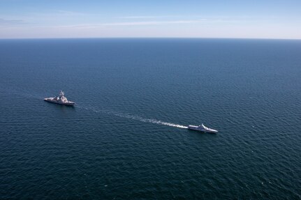 The Arleigh Burke-class guided-missile destroyer USS Roosevelt (DDG 80), left, and the Swedish Navy Visby-class corvette HSwMS Härnösand (K 33) steam in formation during Neptune Strike 23-2, in the Baltic Sea, July 12, 2023. Roosevelt is participating in Neptune Strike 23-2, a multiyear effort focused on the integration of U.S. and NATO allied and partner international force to provide assurance, deterrence, and collective defense for the Alliance and STRIKFORNATO. (U.S. Navy photo by Mass Communication Specialist 2nd Class Elexia Morelos)