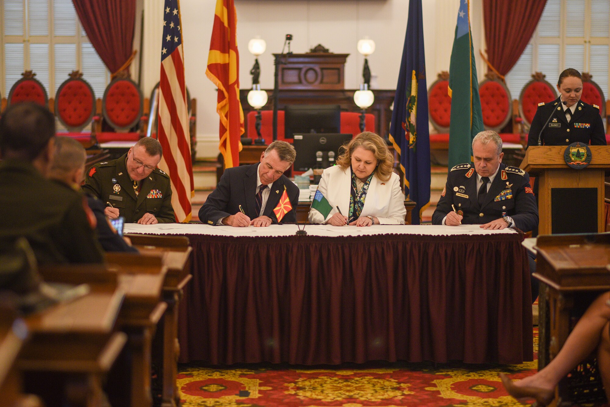 (Left to Right) U.S. Army Maj. Gen. Greg Knight, Vermont National Guard Adjutant General, Gov. Phil Scott, Vermont Governor, Minister Slavjanka Petrovska, North Macedonia Minister of Defense, Lt. Gen. Vasko Gjurchinovski, North Macedonia Chief of Defense sign documents reaffirming North Macedonia’s and the Vermont National Guard’s continued partnership, Montpelier, Vt. June 9, 2023.