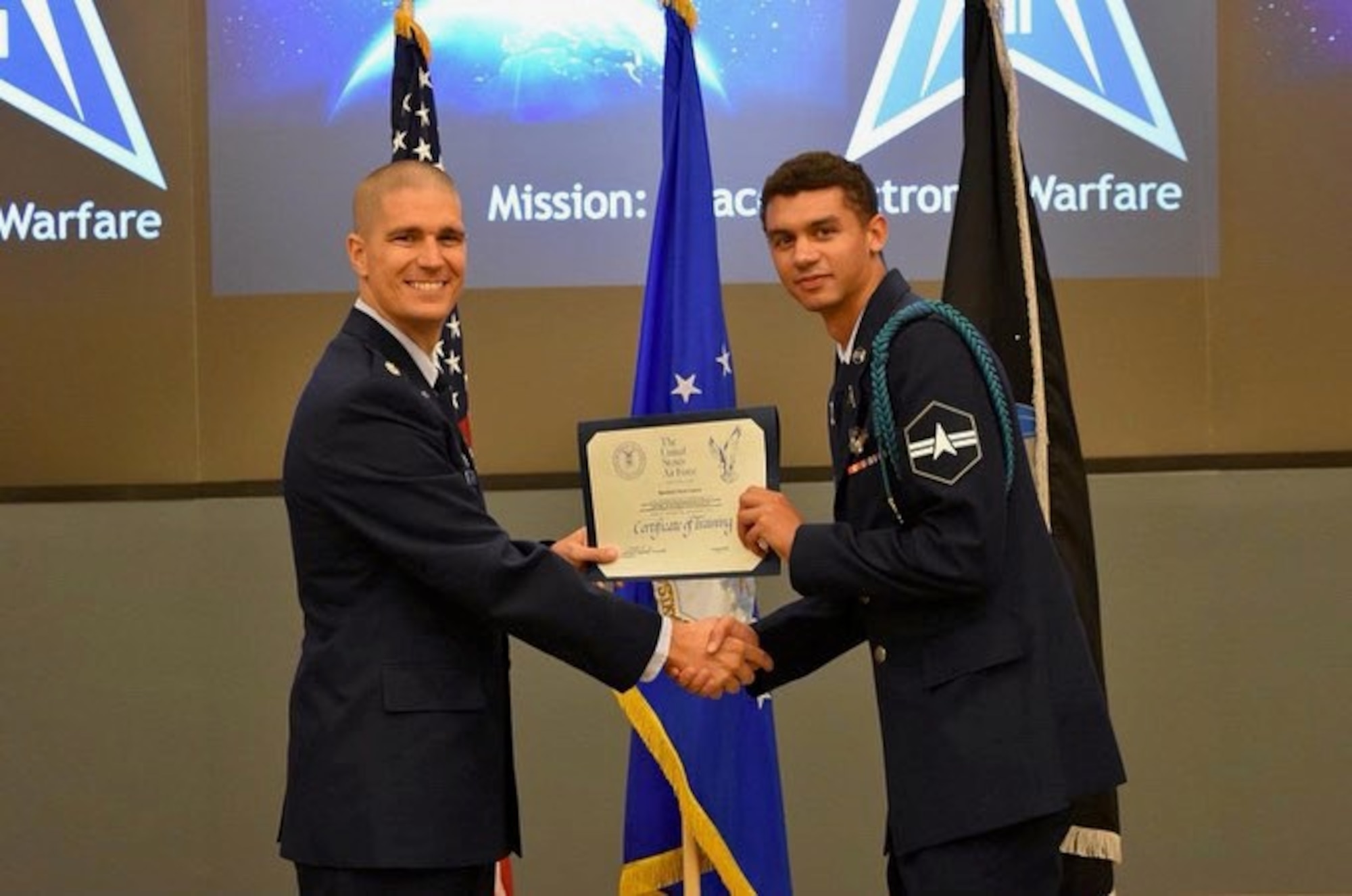 U.S. Space Force Spc. 3 Kevin Capone poses for an official photo after receiving a training certificate. Capone serves as an Electromagnetic Warfare Operator with the 5th Electromagnetic Warfare Squadron.