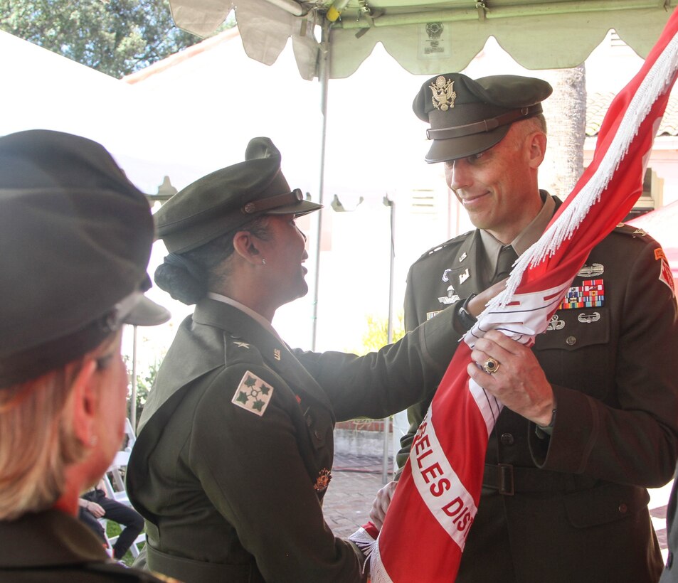 Col. Andrew Baker, right, formally marks his entry as the 64th commander of the U.S. Army Corps of Engineers Los Angeles District during the passing of the colors at the district’s change of command ceremony July 14 at the LA District Base Yard in South El Monte, California. Brig. Gen. Antoinette Gant, U.S. Army Corps of Engineers South Pacific Division commander, center, served as presiding officer for the ceremony. At left is Col. Julie Balten, outgoing LA District commander.