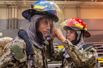 Naval ROTC midshipman candidates during firefighting application training at Recruit Training Command.
