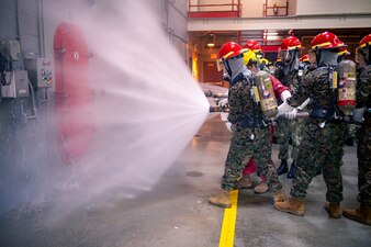 Naval ROTC midshipman candidates firefighter training at Recruit Training Command.