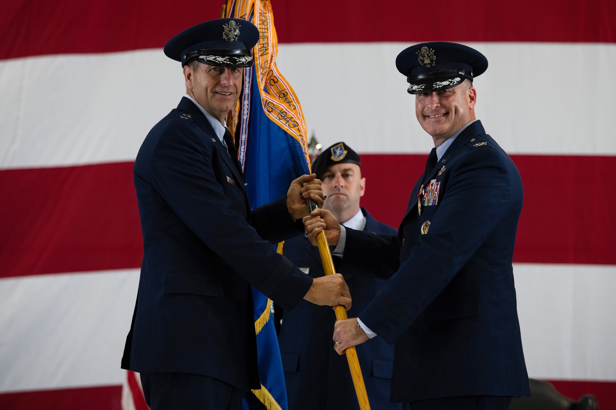 U.S. Air Force members pass guidon