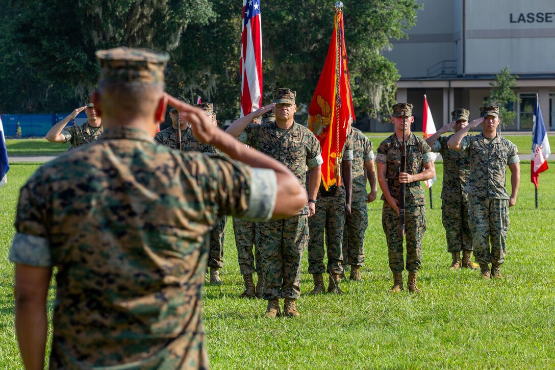 U.S. Marine Corps Col. Karl Arbogast, outgoing commanding officer, Marine Corps Air Station (MCAS) Beaufort, renders a salute during the national anthem at a Change of Command ceremony, MCAS Beaufort, South Carolina, July 7, 2023. Arbogast relinquished command of MCAS Beaufort to Col. Mark Bortnem. (U.S. Marine Corps photo by Lance Cpl. Nathan Saucier)