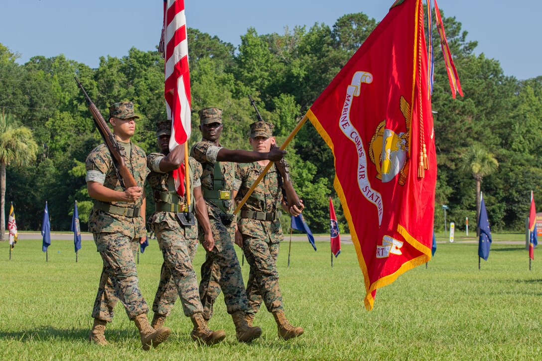 U.S. Marines with Headquarters and Headquarters Squadron Color Guard march during a Change of Command Ceremony at Marine Corps Air Station (MCAS) Beaufort, South Carolina, July 7, 2023. Col. Karl Arbogast relinquished command of MCAS Beaufort to Col. Mark Bortnem. (U.S. Marine Corps photo by Lance Cpl. Nathan Saucier)