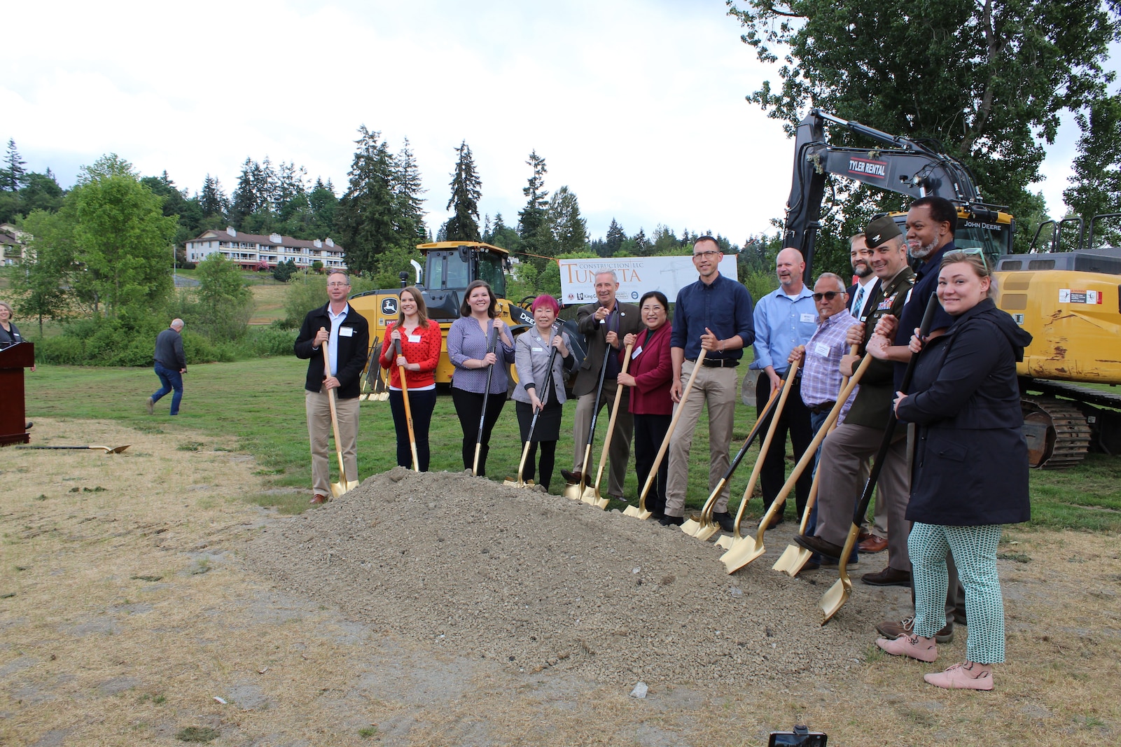 Photos of a group of people at a groundbreaking ceremony.