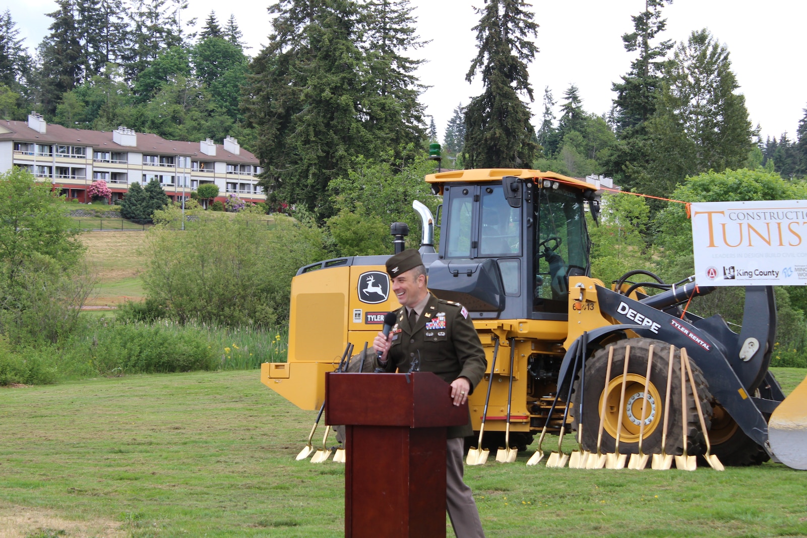 Photos of a group of people at a groundbreaking ceremony.