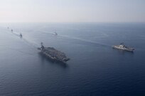 The Gerald R. Ford Carrier Strike Group sails in formation with NATO allied ships during an integrated sailing event, July 11, 2023. The ships sailing include the world’s largest aircraft carrier USS Gerald R. Ford (CVN 78), French Navy frigate FS Languedoc (D653), Arleigh Burke-class guided-missile destroyer USS Ramage (DDG 61), Ticonderoga-class guided-missile cruiser USS Normandy (CG 60), Arleigh Burke-class guided missile destroyer USS Thomas Hudner (DDG 116) and Italian guided-missile frigate ITS Carabiniere (F593). Gerald R. Ford is participating in Neptune Strike, a multiyear effort focused on harmonizing U.S. and NATO planning teams to transfer command and control of Allied naval and amphibious forces to STRIKFORNATO, in order to provide assurance, deterrence, and collective defense for the Alliance. (U.S. Navy photo by Mass Communication Specialist 2nd Class Jacob Mattingly)