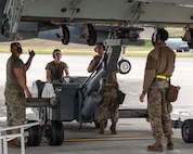 Aircraft armament systems technicians assigned to the 69th Bomb Squadron unload a B-52H Stratofortress at Joint Base Elmendorf-Richardson, Alaska, July 11, 2023. The B-52s, air crew and maintenance Airmen were sent to JBER to participate in a bomber Agile Combat Employment, to  test the readiness and capability of our strategic deterrent force. (U.S. Air Force photo by Senior Airman Evan Lichtenhan)