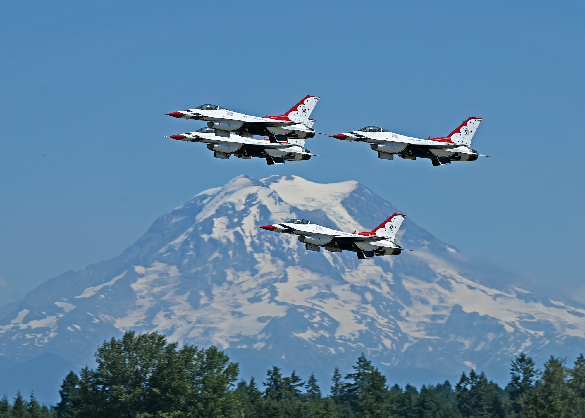 The U.S. Air Force Air Demonstration Squadron “Thunderbirds” #1-4 fly F-16 Fighting Falcons above the McChord Field flightline during their rehearsal for the Joint Base Lewis-McChord Airshow and Warrior Expo at JBLM, Washington, July 14, 2023. The mission of the JAWE is to foster goodwill to educate and familiarize attendees with the people, mission, and equipment of the Air Force, Army, and other Armed Services while continuing to provide installation-wide mission support. The U.S. Air Force Air Demonstration Squadron “Thunderbirds” are one of the JAWE’s premier acts and will be joined by aerial demonstrations from the C-17 West Coast Demonstration Team, Tora! Tora! Tora! and many more. (U.S. Air Force photo by Senior Airman Callie Norton)