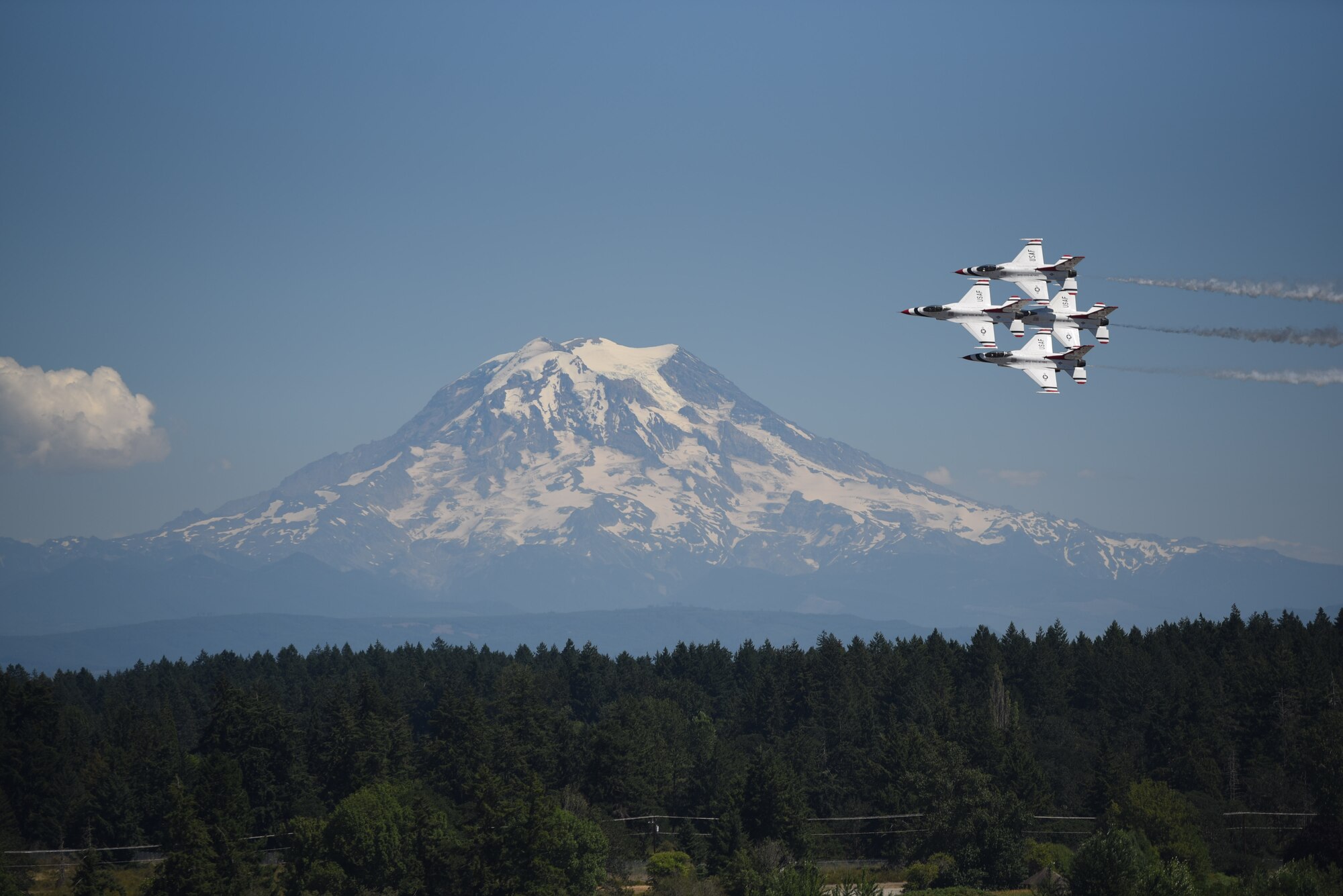 The U.S. Air Force Air Demonstration Squadron “Thunderbirds” #1-4 fly F-16 Fighting Falcons above the McChord Field flightline during their rehearsal for the Joint Base Lewis-McChord Airshow and Warrior Expo at JBLM, Washington, July 14, 2023. The mission of the JAWE is to foster goodwill to educate and familiarize attendees with the people, mission, and equipment of the Air Force, Army, and other Armed Services while continuing to provide installation-wide mission support. The Thunderbirds are one of the JAWE’s premier acts and will be joined by aerial demonstrations from the C-17 West Coast Demonstration Team, Tora! Tora! Tora! and many more. (U.S. Air Force photo by Airman 1st Class Kylee Tyus)