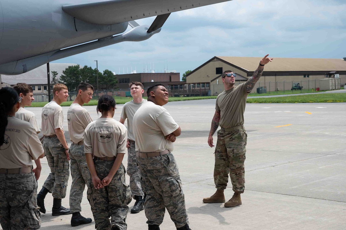 Tech. Sgt. Alexander Coppola, a Crew Chief with the 914th Aircraft Maintenance Squadron, shows cadets the exterior of a KC-135 Stratotanker during the second annual New York State Civil Air Patrol encampment that took place at Hancock Field Air National Guard Base, Syracuse, New York, July 12, 2023. Cadets were offered the opportunity to ask questions and learn how air refueling works. (U.S. Air Force Photo by Senior Airman Kylar Vermeulen)