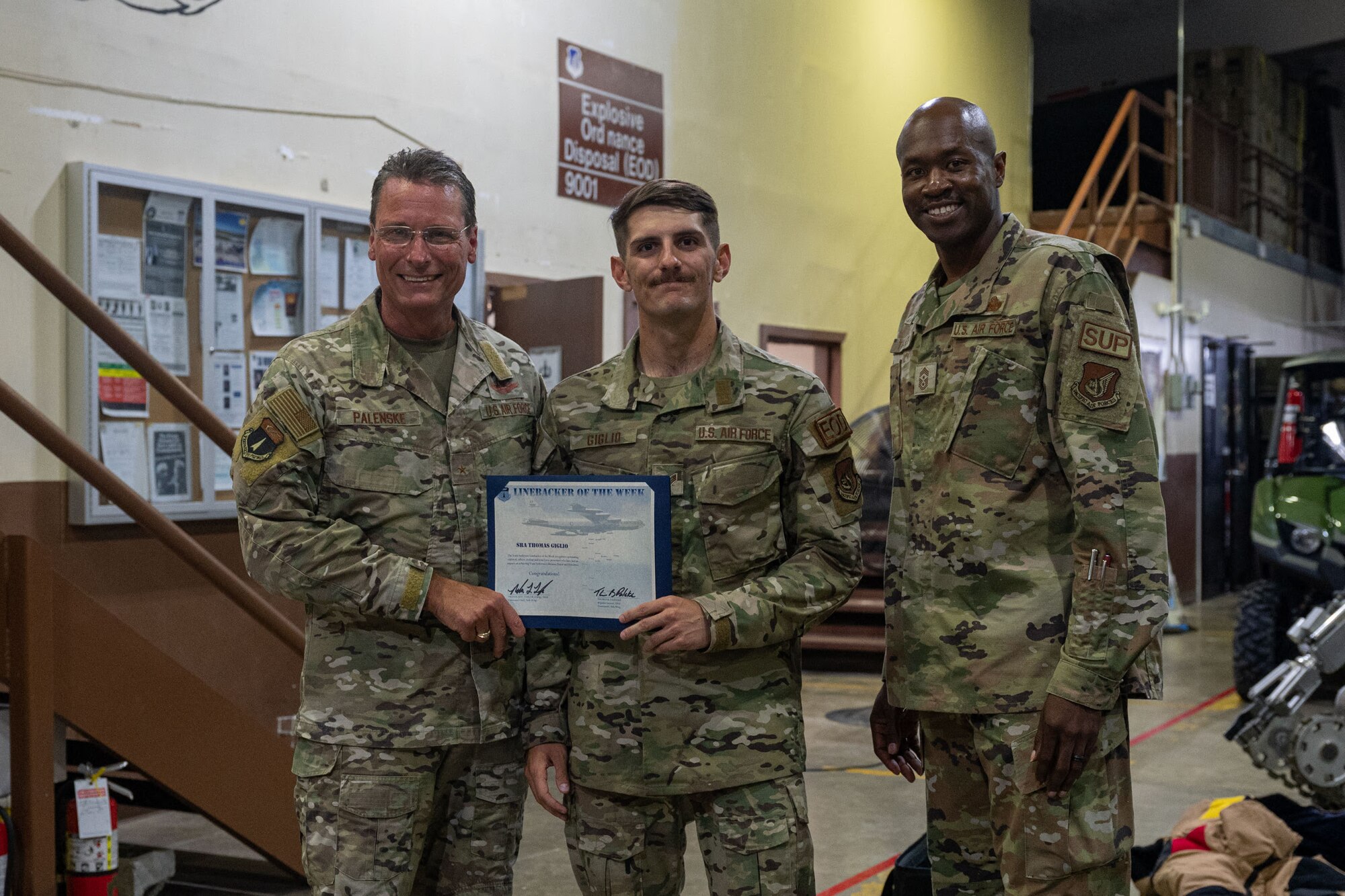 Photo of an Airman receiving the Linebacker of the Week Award